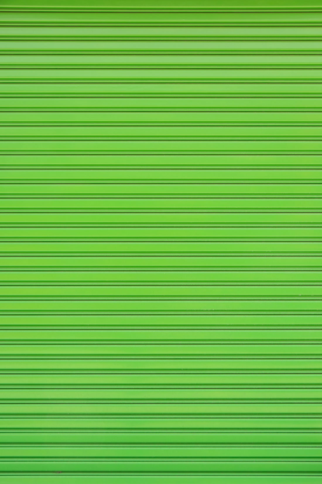 a close up of a green garage door